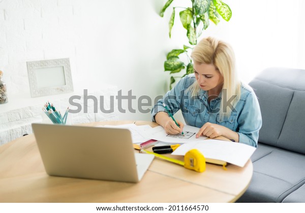 Architect working
on blueprint. Architects workplace - architectural project,
blueprints, ruler, calculator, laptop and divider compass.
Construction concept. Engineering
tools