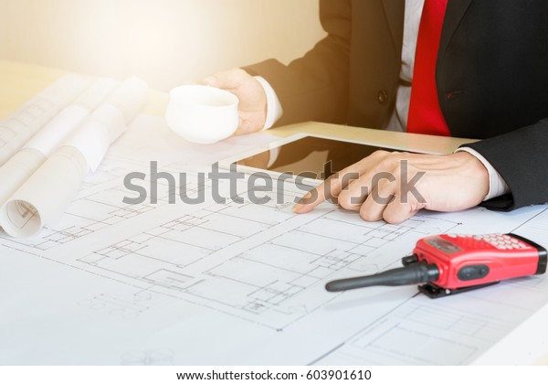 Architect working
on blueprint. Architects workplace - Architectural project
blueprints drawings Engineering
tools