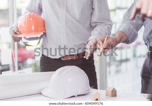 Architect\
working on blueprint. Architects workplace - architectural project.\
Construction concept. Engineering\
tools.