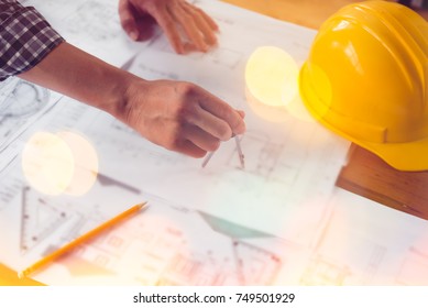 Architect working on blueprint, engineer inspective in workplace - architectural project, blueprints. Construction concept. Engineering tools,selective focus