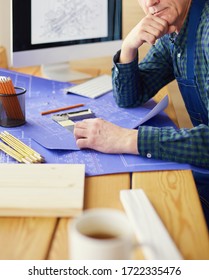 Architect working on drawing table in office