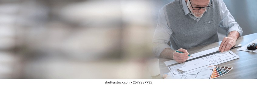 Architect working on a project and using a ruler; panoramic banner