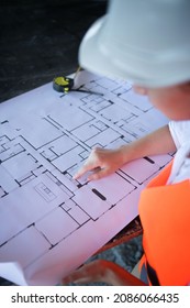 Architect working over plan. Closeup Desk With blueprints drawing