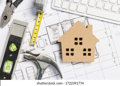 Architect workplace top view. Architectural project, blueprints, blueprint rolls on table. Construction background. Engineering tools. Copy space - Shutterstock ID 1722391774
