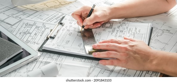 Architect Works Remotely From Home In Quarantine, Lockdown Covid 19 Coronavirus. Remote Work, Stay Home, New Normality, Social Distance. Architect Design Working Drawing Sketch Plans Blueprints