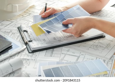 Architect Works Remotely From Home In Quarantine, Lockdown Covid 19 Coronavirus. Remote Work, Stay Home, New Normality, Social Distance. Architect Design Working Drawing Sketch Plans Blueprints