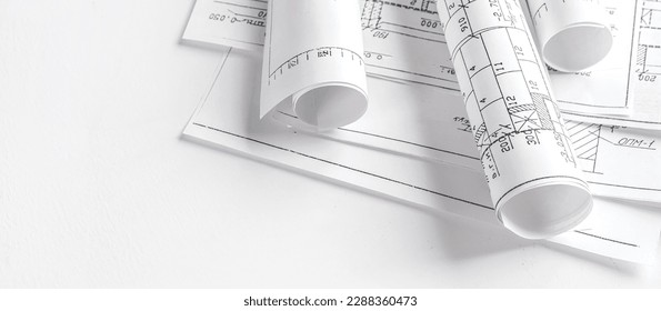 Architects concept, engineer architect designer freelance work on start-up project drawing, construction plan architect design working drawing sketch plans blueprints and making construction model - Powered by Shutterstock