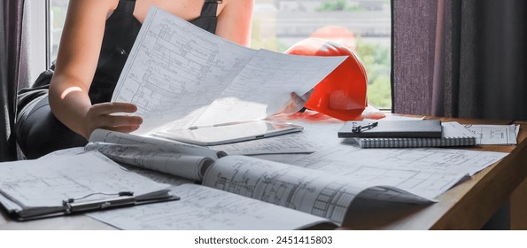 Architects concept, engineer architect designer freelance work on start-up project drawing, construction plan. architect design working drawing sketch plans blueprints and making construction model