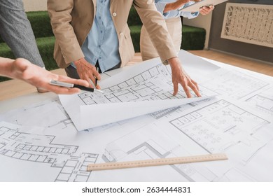 Architects concept, engineer architect designer freelance work on start-up project drawing, construction plan architect design working drawing sketch plans blueprints and making construction model