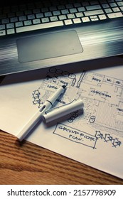 Architect's Desk, Sketch Paper, Notebook Computer Placed On A Wooden Table.