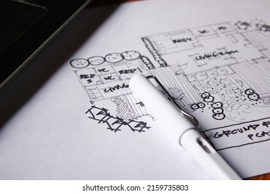 Architect's Desk, Sketch Paper, Notebook Computer Placed On A Wooden Table.