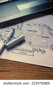 Architect's Desk, Sketch Paper, Notebook Computer Placed On A Wooden Table.