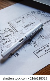 Architect's Desk, Sketch Paper, Notebook Computer Placed On A Wooden Table.