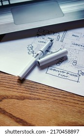 Architect's Desk, Sketch Paper, Notebook Computer Placed On A Wooden Table.