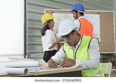 Architects engineer and construction foremen review the work and talk about how the project, .Examining blueprint with construction manager. - Powered by Shutterstock