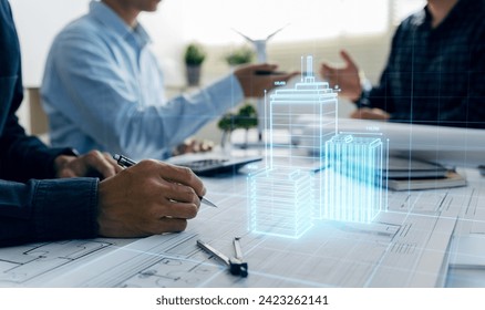 Architects engineer contractor working in office with blueprints and building hologram, Team work and construction concept. - Powered by Shutterstock