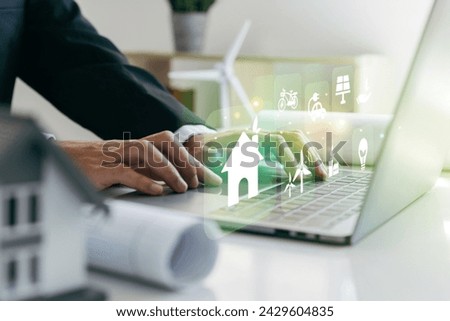 Architects engineer using laptop with home design combined with using natural energy, Sustainable development concept.