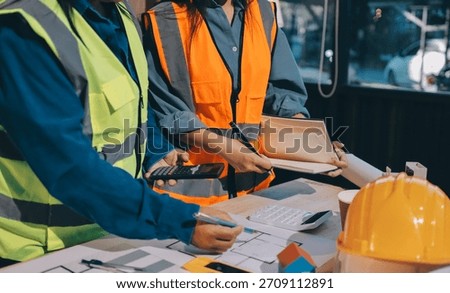 Architects and engineers working collaboratively on construction project
