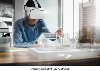 Architects female wearing virtual reality headsets for work with virtual reality modeling software applications. Use Virtual Reality Modeling and BIM Technology in the Building complete. - Powered by Shutterstock