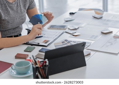Architects interior designer hands working with Blueprints and documents for a home renovation for house design