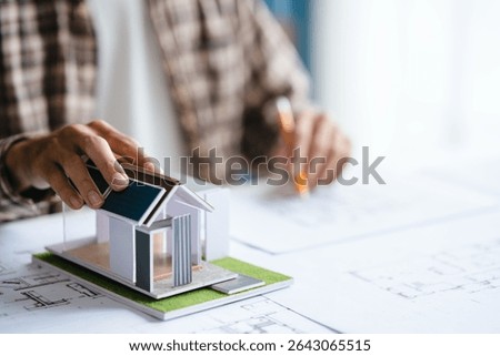 Architects interior designer hands working with Blueprints and documents for a home renovation for house design