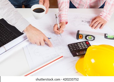 Architects meeting discussing a new draft plans - Shutterstock ID 420233752