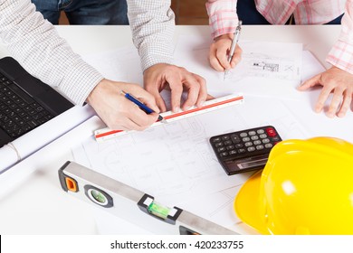 Architects meeting discussing a new draft plans - Shutterstock ID 420233755