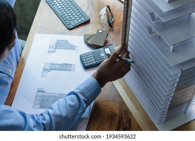 Architect's worked while sketching the details of the building, Design from his idea stationery on desk office. Startup and analysis about the architecture of the building.