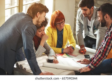 Architects working together - Team of young creative people - Shutterstock ID 657590344
