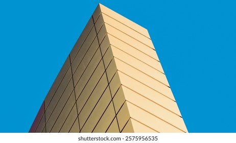 architectural abstract pattern fragment of a wall of a yellow modern building on a blue background