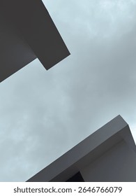 Architectural angles against a cloudy sky.
