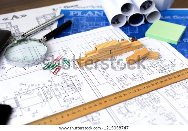 Architectural\
blueprints - drawings, pencil, calculator, calculations, plan,\
ruler, computer. Business and science.\
