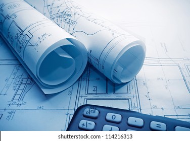 Architectural blueprints rolls and calculator