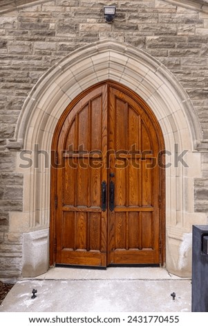 Architectural building details with large wooden church door