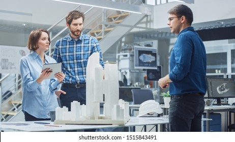 In Architectural Bureau: Team Of Architects And Engineers Working On A Building Complex Prototype Project, Using City Model And Computers Running 3D CAD Software. Residential Or Business District