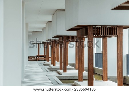 Architectural Column in Wooden Built Structure. Impressive modern architecture with empty wooden interior and grand architectural columns. Japanese wooden style. 