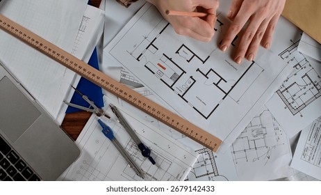 Architectural Design Process Illustrated with Drafting Tools and Blueprints