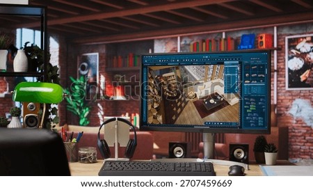 Architectural design software on computer in home office used for moving interior design project assets. CAD software interface on PC display showing home floor plans, jib up shot
