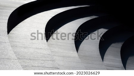 Architectural design of stairs. Curvilinear steps. Modern abstract geometric background. Black and white