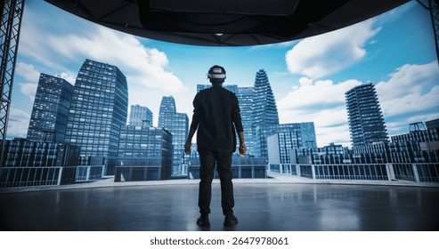 Architectural Designer in a VR Headset Designs Futuristic Cityscapes on a Big Panoramic Digital Screen that Reflects His Computer Vision. Virtual Reality Technology Innovation and Creativity Concept