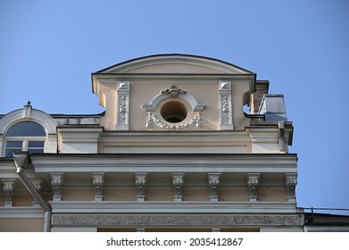 an architectural detail decorating the parapet of a historic building in the corner of the building - Shutterstock ID 2035412867