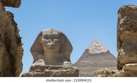 Architectural detail of the Giza pyramid complex with the Great Sphinx of Giza in the foreground and, in the background on the right, the Pyramid of Khafre or of Chephren