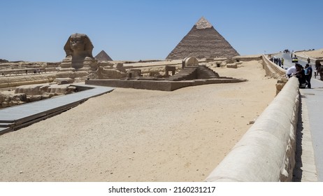 Architectural detail of the Giza pyramid complex with the Great Sphinx of Giza in the foreground and, in the background, the Pyramid of Chephren (right) and the pyramid of Menkaure (left)