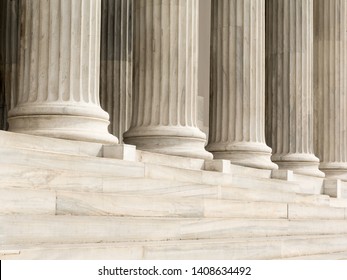 Architectural detail of marble steps and ionic order columns - Shutterstock ID 1408634492