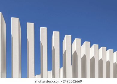 Architectural detail of modern architecture. Abstract geometric composition with details of iron bars painted white against the blue sky. 
Bright details of a minimalist modern building. Contemporary - Powered by Shutterstock