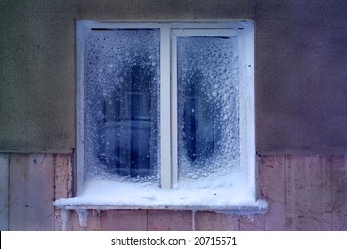 Architectural Detail Of Snow And Ice Covered Window