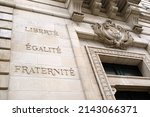 Architectural detail of the town hall of Vannes with the motto of the French Republic Liberty, Equality, Fraternity engraved in french on it