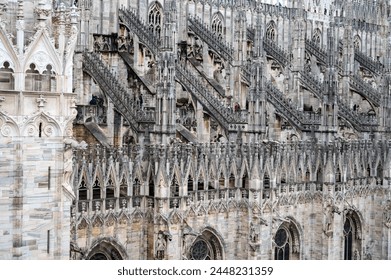 Architectural details of marble Gothic cathedral church in Milan, tourist attraction in northern Italy - Powered by Shutterstock