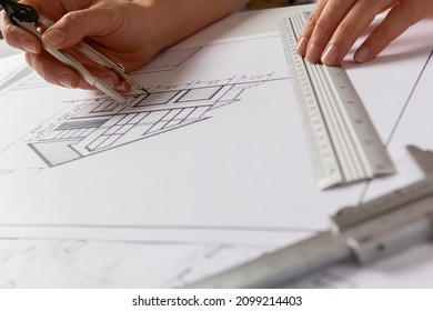 Architectural drawing of a house on a designer's desktop. Blueprints. - Shutterstock ID 2099214403