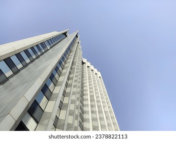 Architectural elements of modern office tower. Low angle view perspective on a skyscraper.